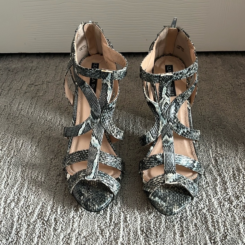 Izabella Rue, snake skin print sandal with heels.